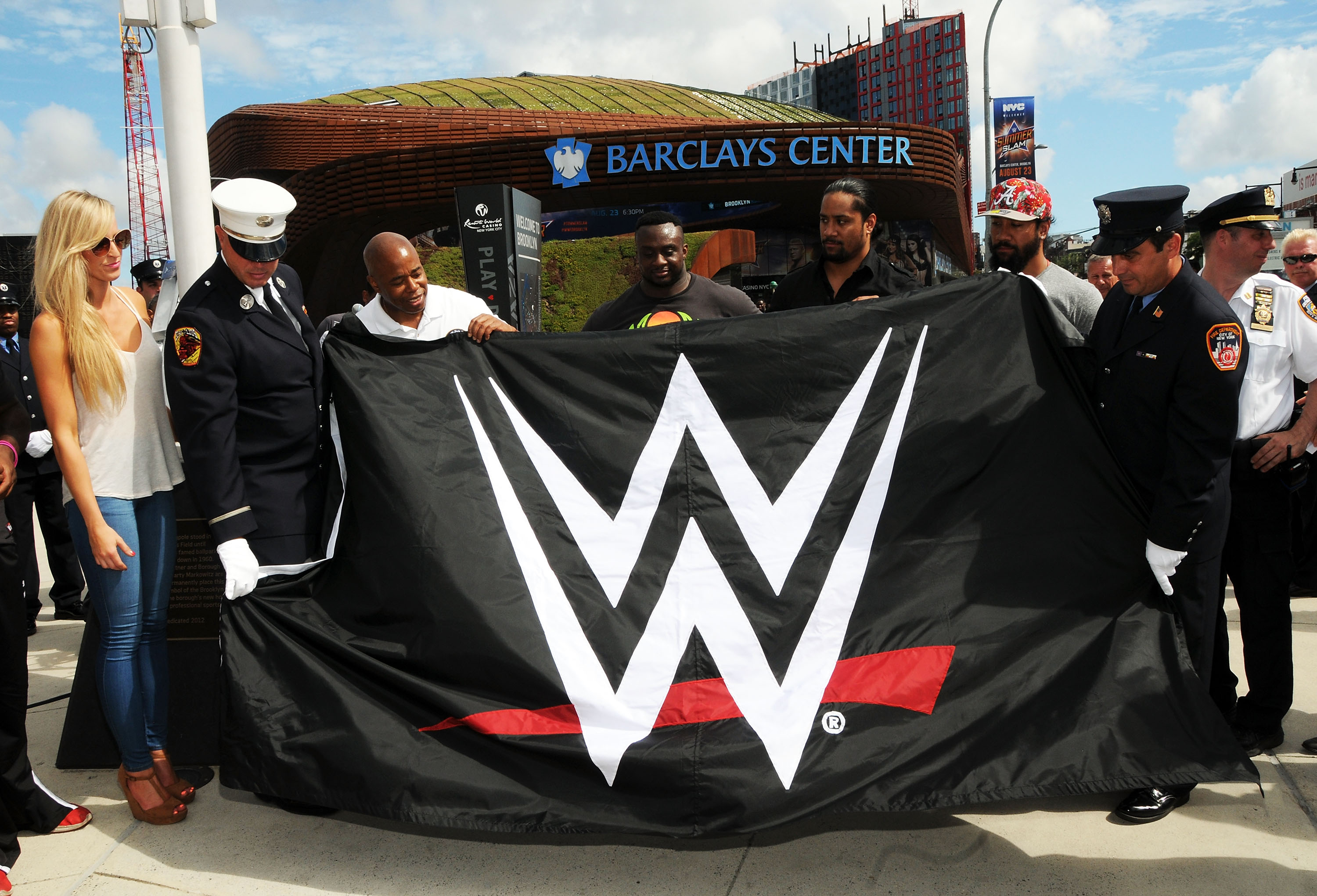 Roman Reigns, Xavier Woods & Summer Rae